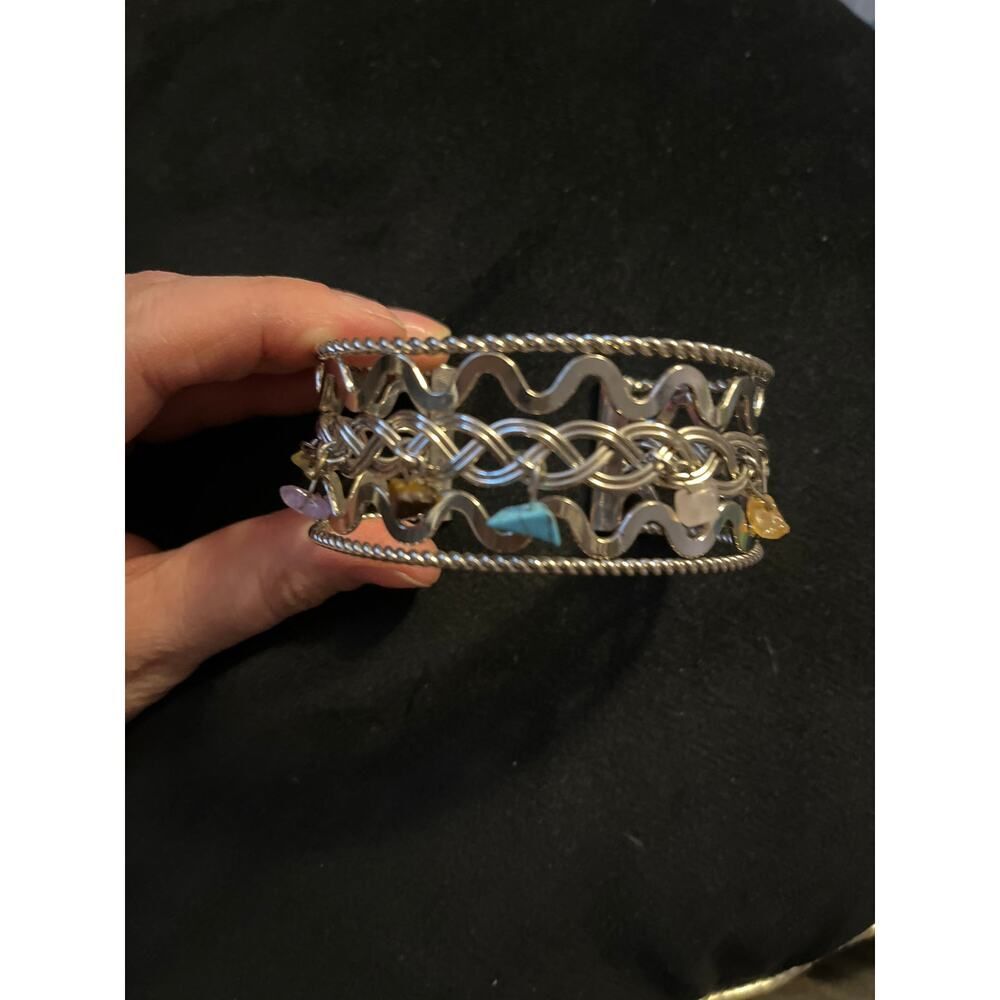 Silver tone cuff bracelet with dangle crystals chakra